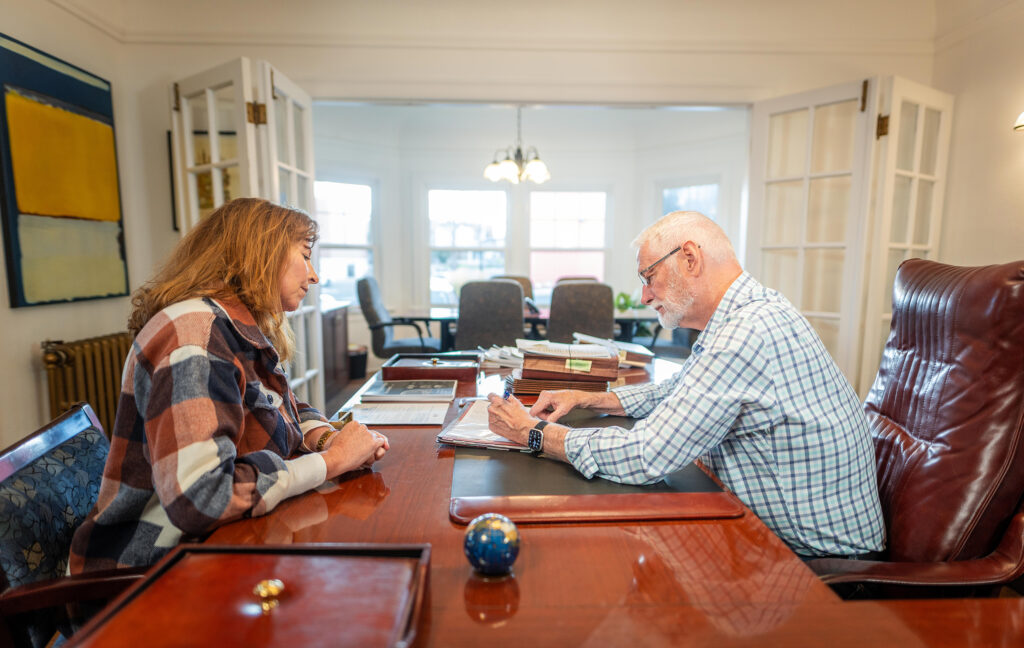 personal injury lawyer working with client