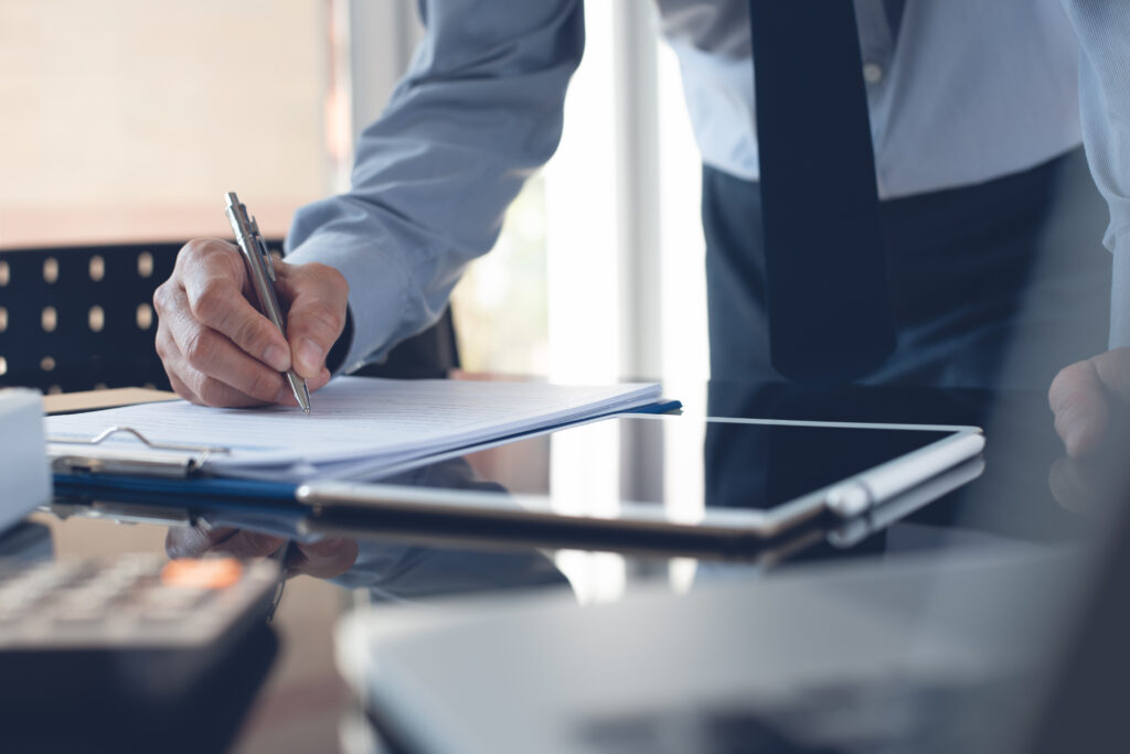 personal injury claim lawyer completing documents