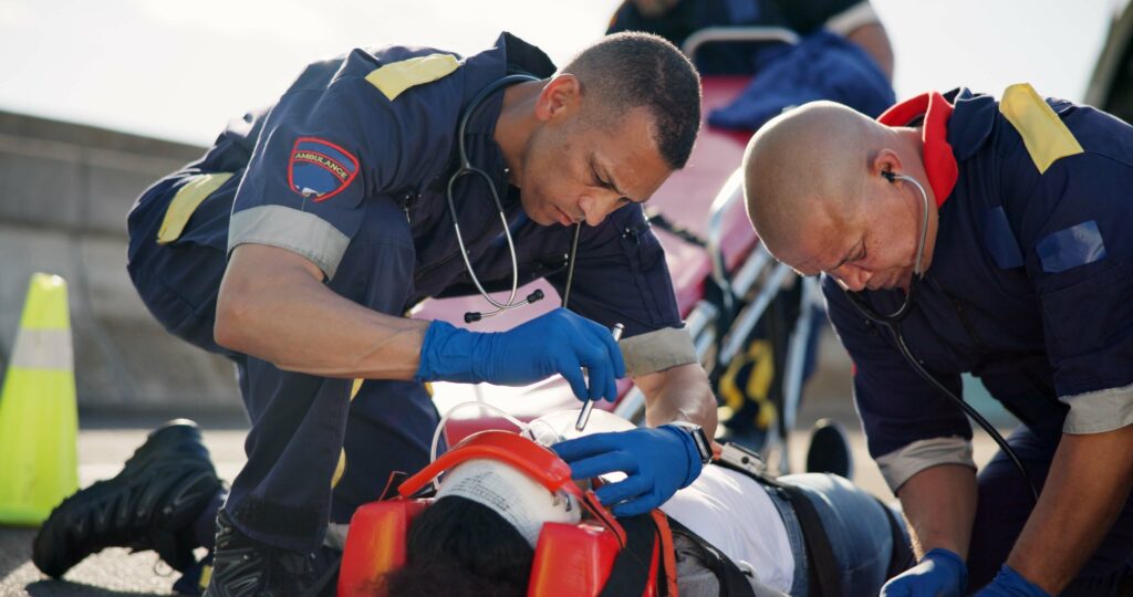 first responders tending to serious injury victim
