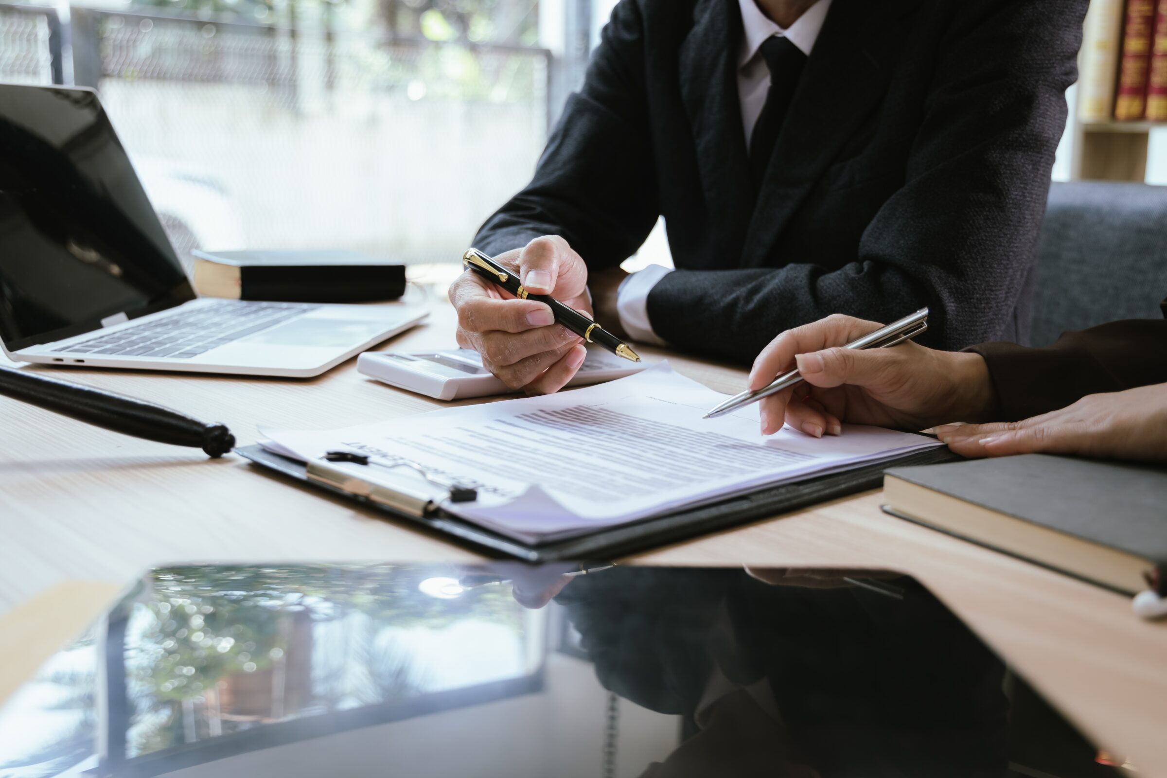 personal injury lawyer filling out paperwork with client in Reno